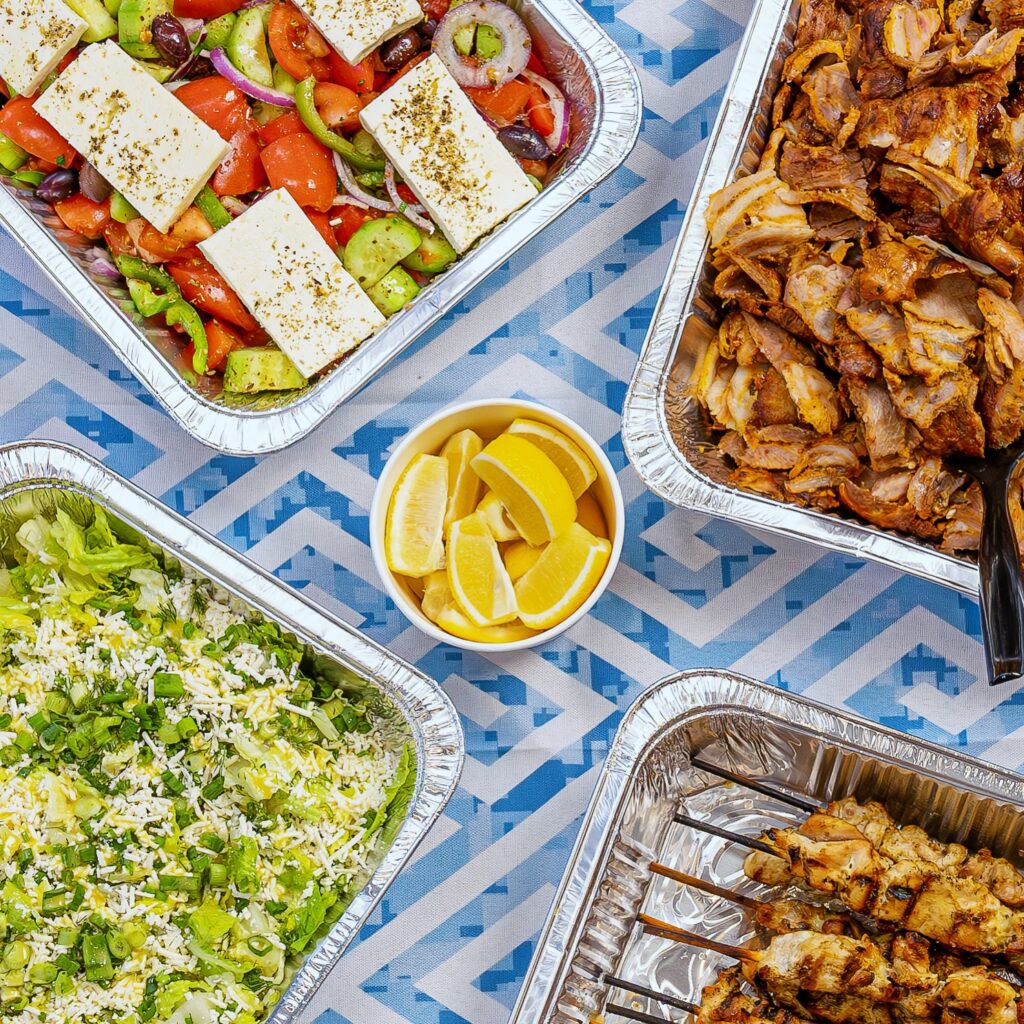 Catering spread of gyro meat, rice and salad