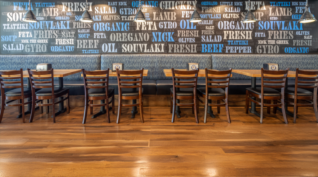 Nick the Greek dining room with blue menu-word wall